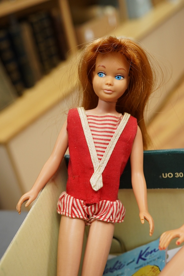 A 1960's Mattel Inc. Barbie doll, 1963, together with a Skipper doll, and a collection of eight original outfits with accessories, sorted into individual packets, outfits purchased between 1963 to 1966 include; American